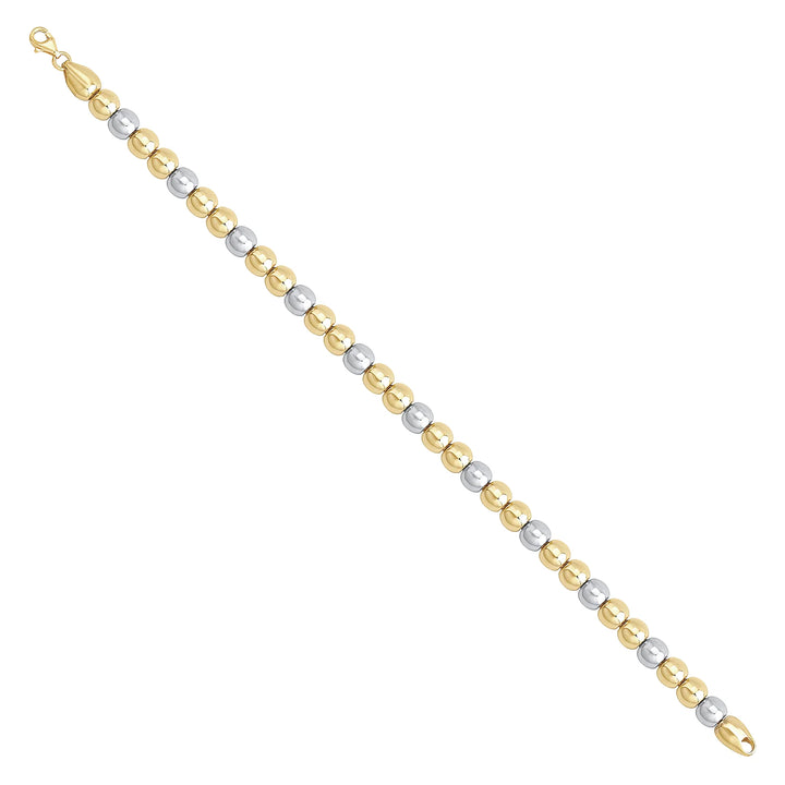 Solid gold bead bracelet, 10.55 g — shown at an angle across the frame.