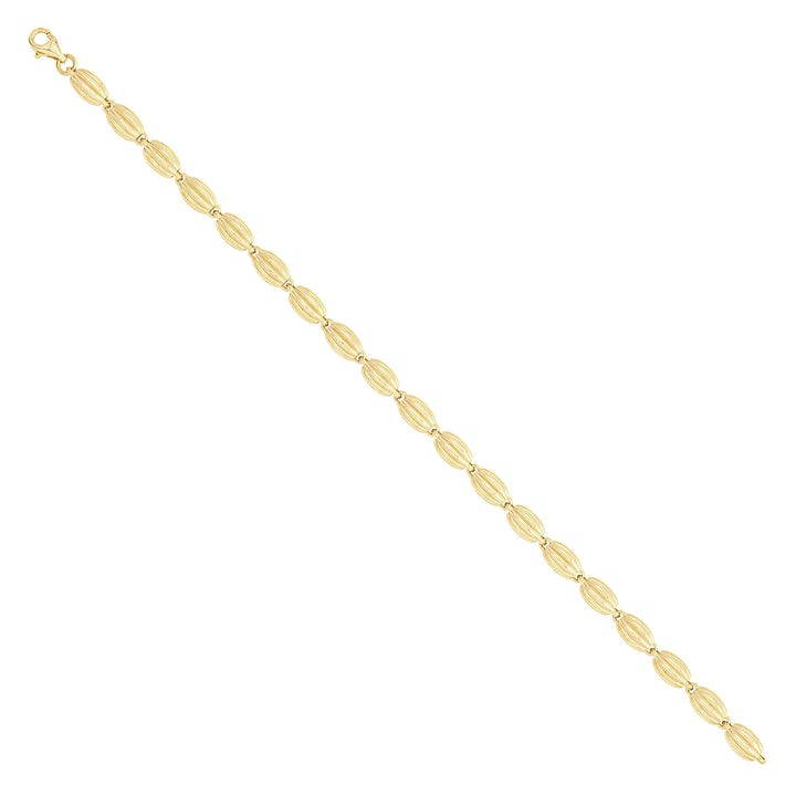 Solid gold bead bracelet, 8.10 g — shown at an angle across the frame.