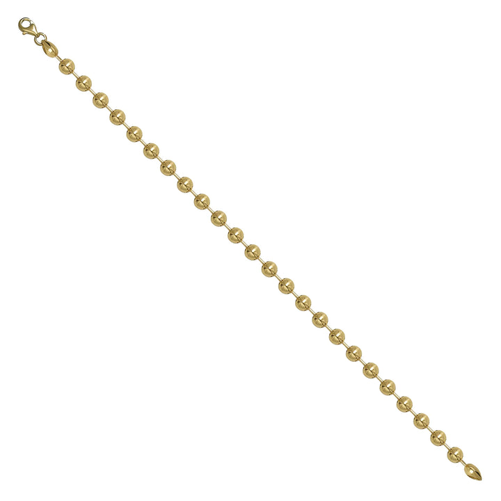 Solid gold bead bracelet, 7.00 g — shown at an angle across the frame.