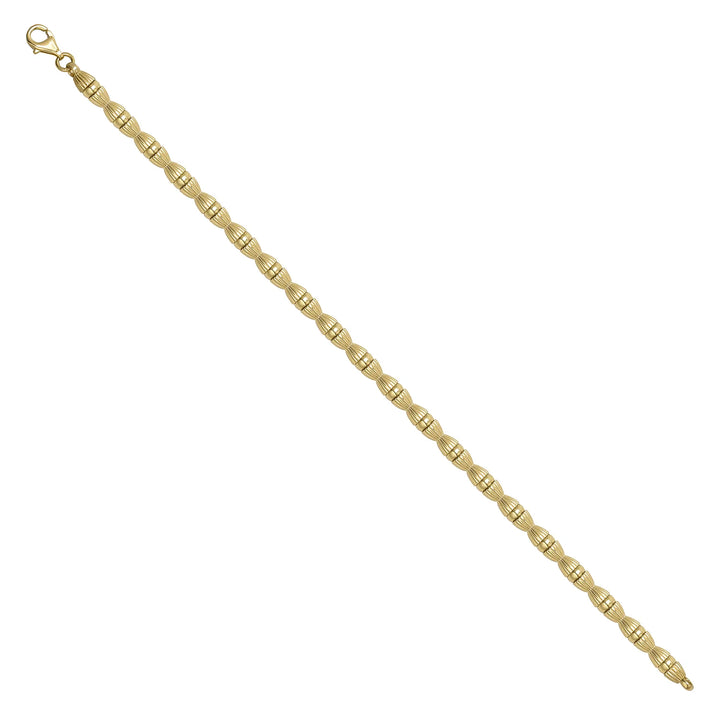 Solid gold fancy link bracelet, 9.95 g — shown at an angle across the frame.